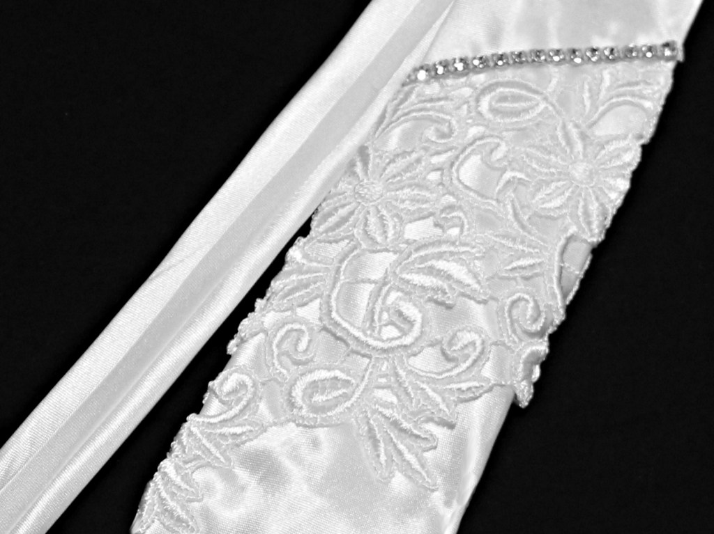 A "Beau" tie is a tie created to match the bride's veil design.