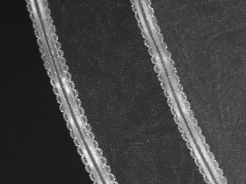 A two-layered veil trimmed with ribbon.